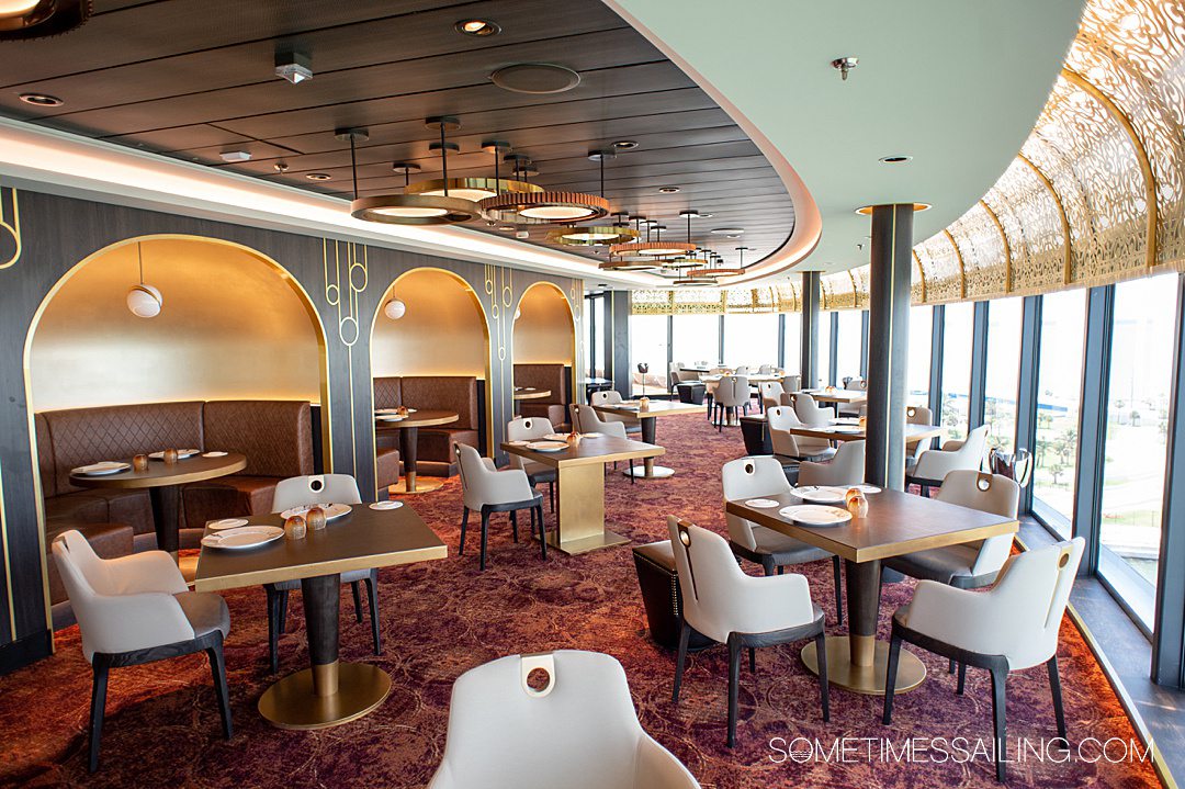 Red, gold and off-white interior of Palo restaurant on Disney Wish cruise ship.