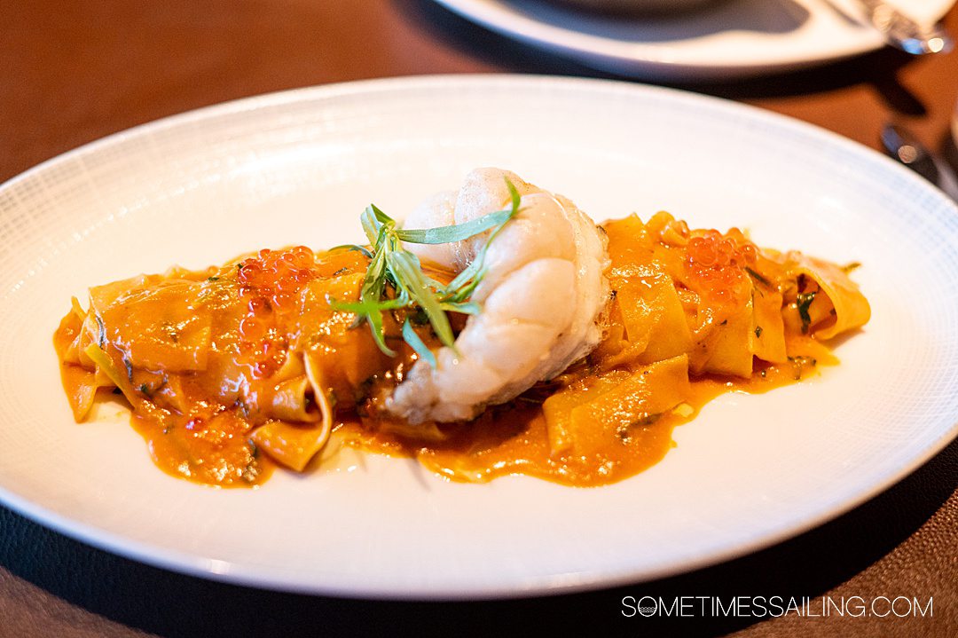 Pasta dish with a lobster tail and caviar at a restaurant on Disney Cruise Line.