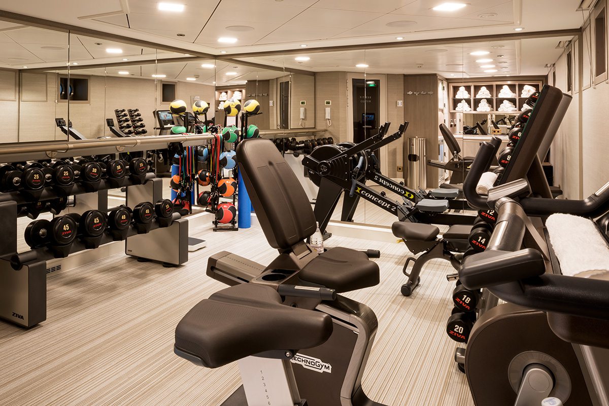 Fitness room with workout gear and equipment in a room on Transcend Cruises river cruise ship.