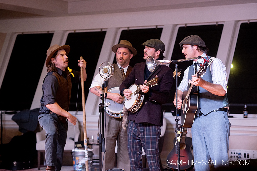 Quartet of musicians singing into microphones on American Serenade river cruise ship.