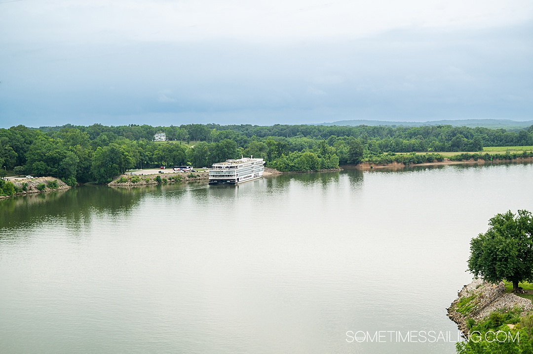 River cruise ship in the distance on the Tennessee River for an American Cruise Lines cruise.