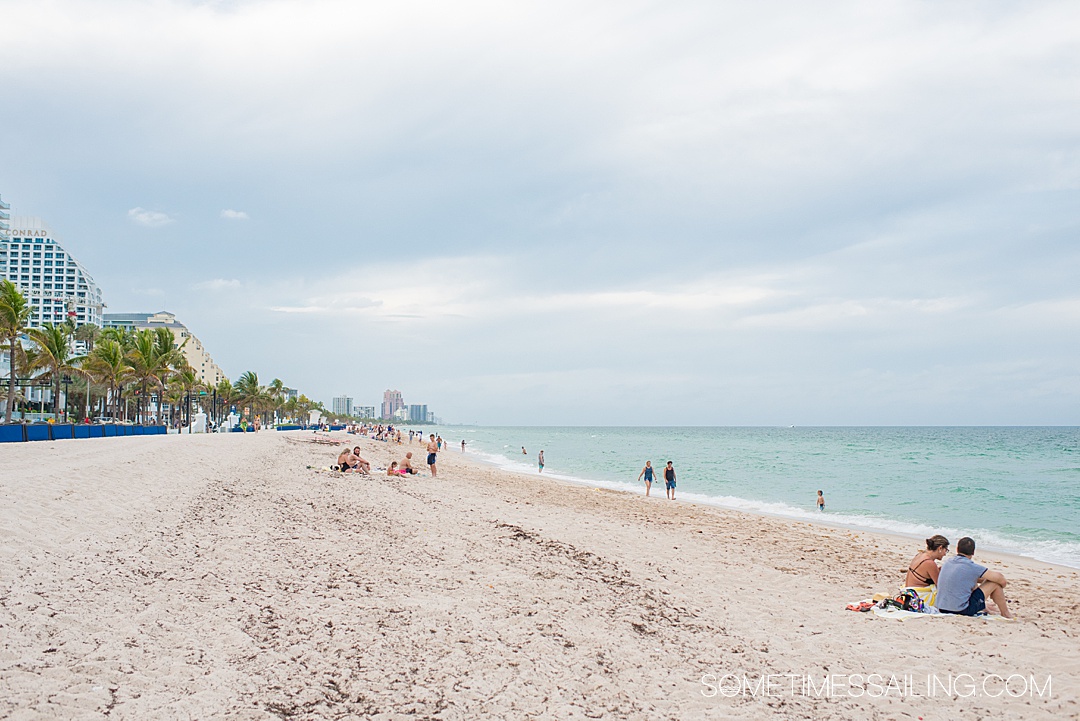 Fort Lauderdale beach on an overcast day with aqua water and the sandy shoreline.