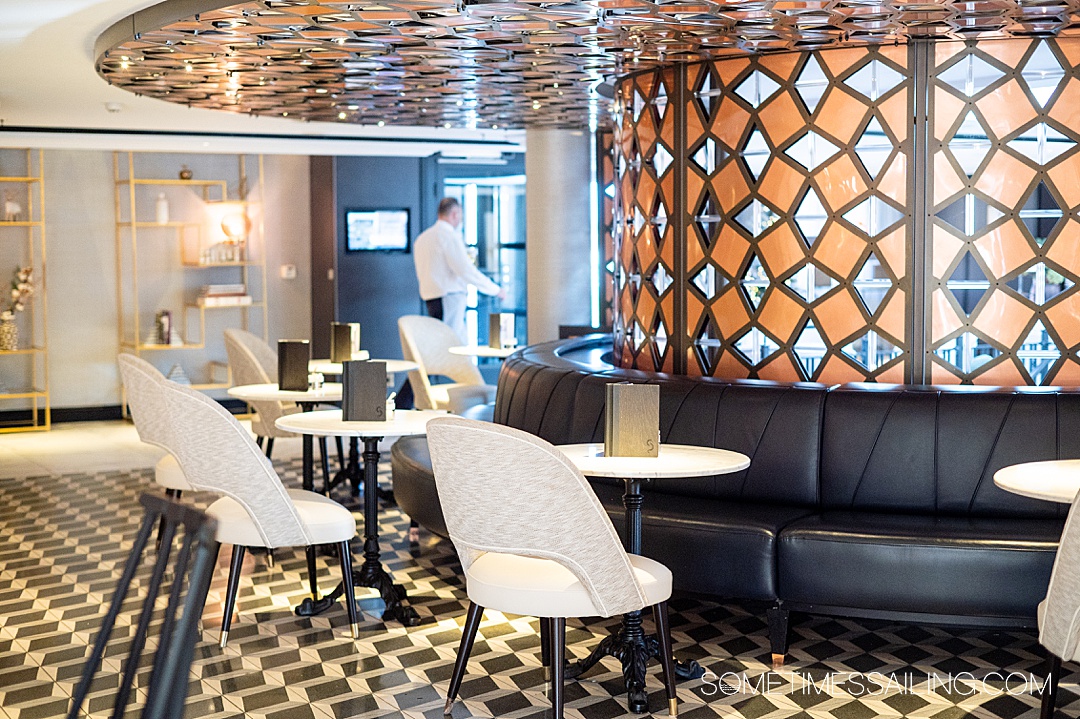 Inside seating at the Bistro on Riverside Mozart with white, black and copper finishes.