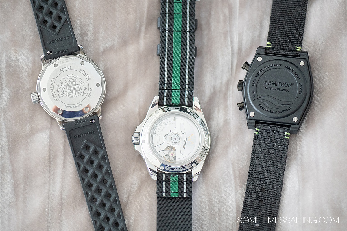 Back side of three travel watches.