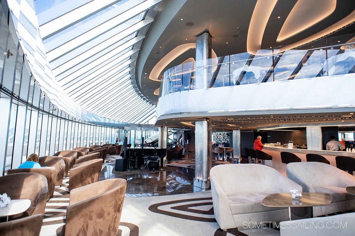 Lounge area of MSC Yacht Club with two decks, on MSC Seashore.