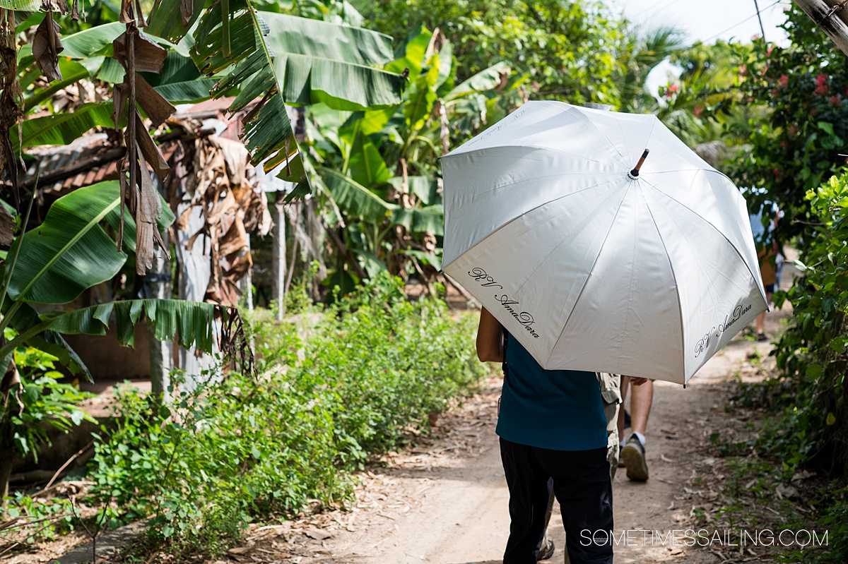Umbrella with "AmaWaterways" on it during a Mekong River Cruise excursion in Cambodia.