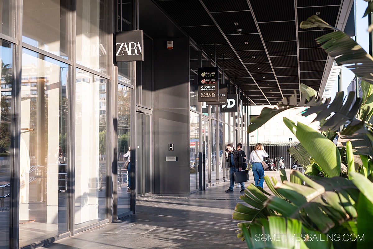 Modern shopping entrance with a "ZARA" sign.