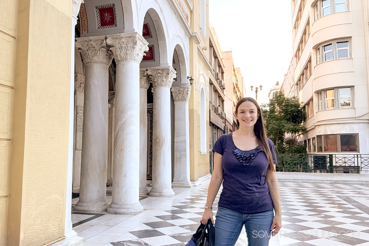 Woman in front of a beautiful church in Piraeus, Greece.