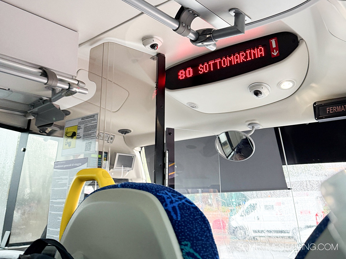 Inside a public bus in to Chioggia with a digital sign with red letters.