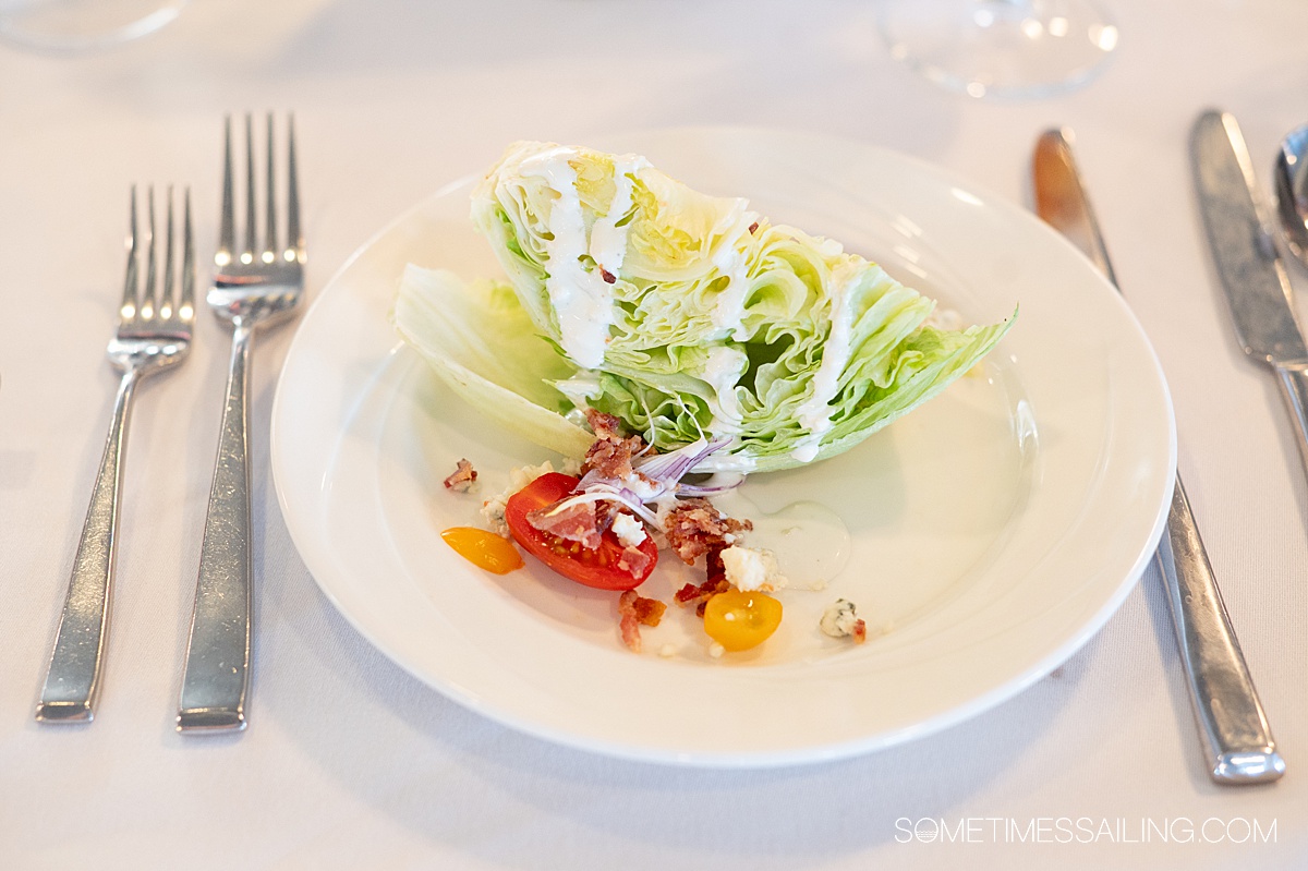 Wedge salad on a plate.