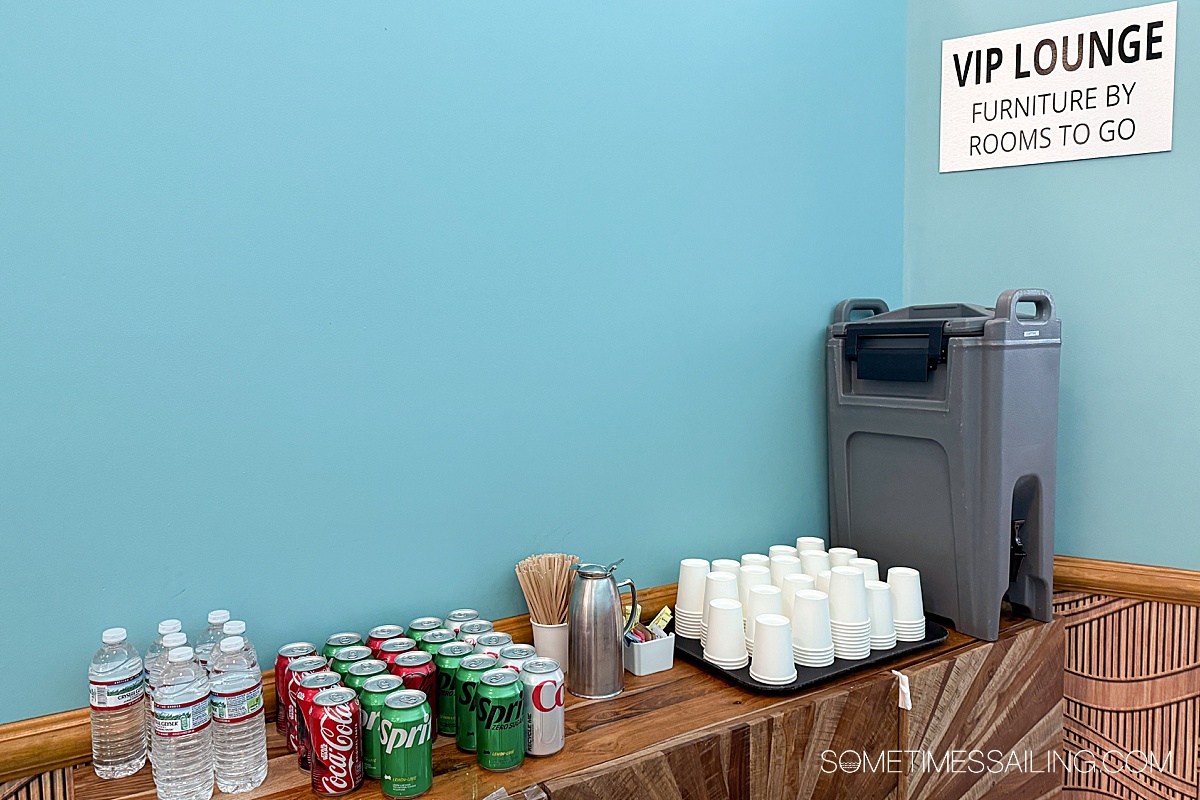 Blue walls with a table with soft drinks on it for Margaritaville at Sea Islander special experiences.
