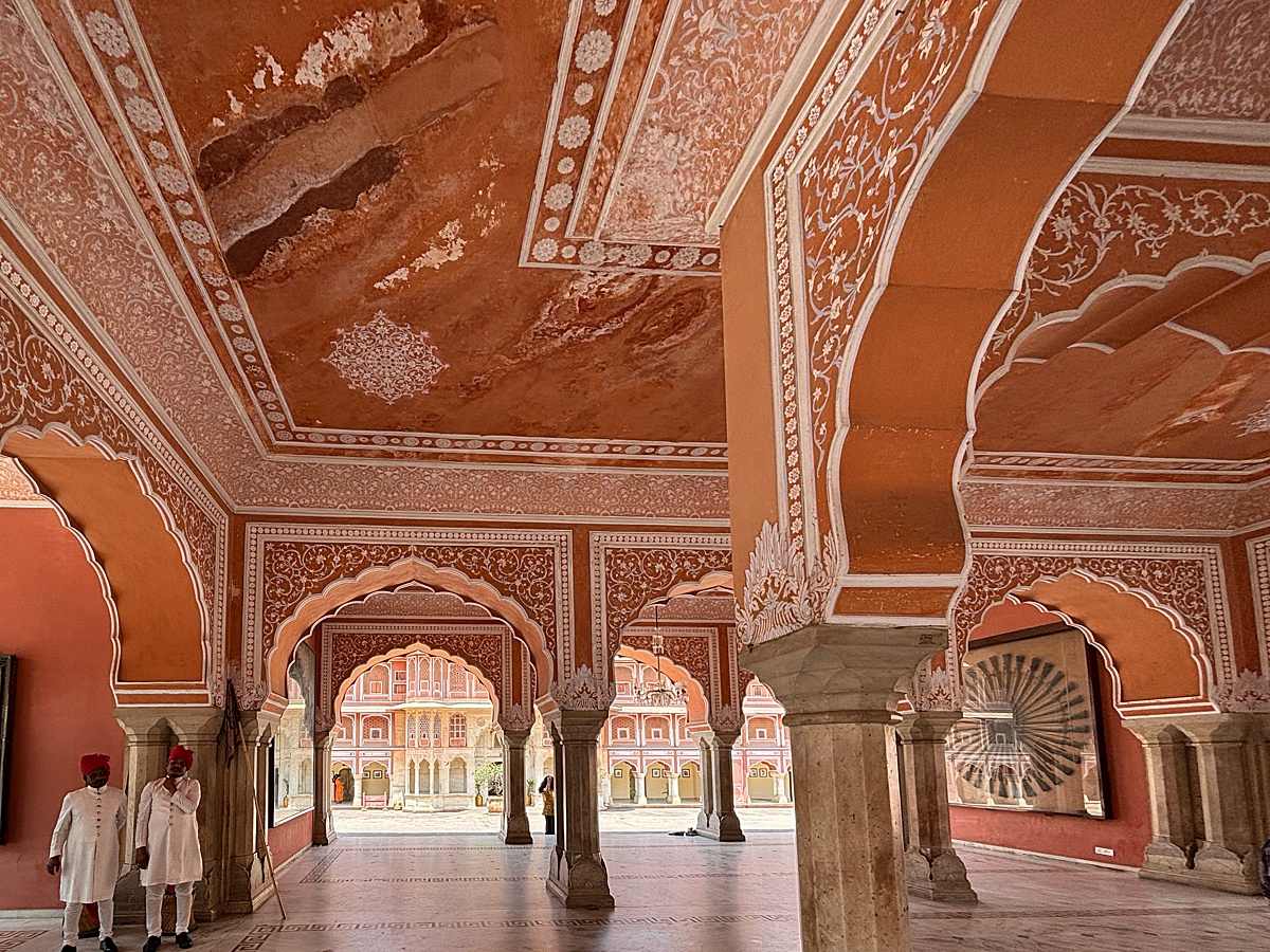 Jaipur City Palace interior with coral painted walls with white details.
