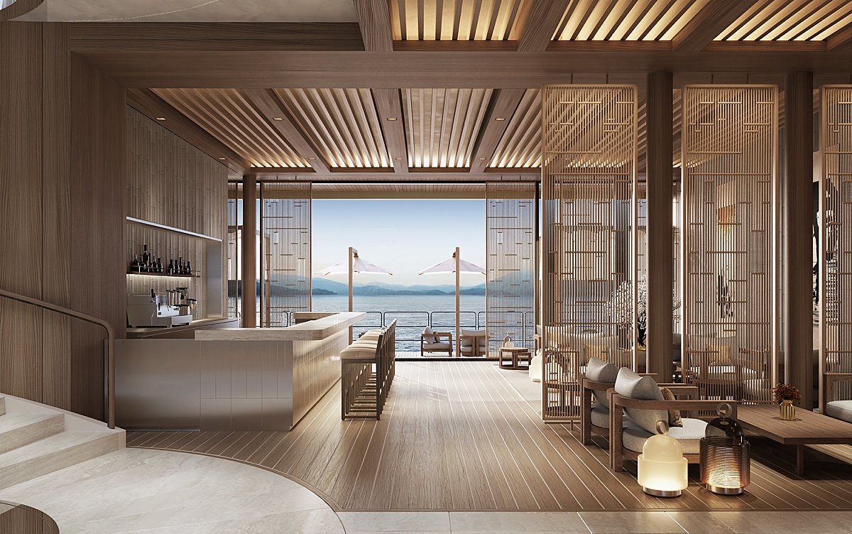 Inside the lounge adjacent to the ocean marina deck on Aman at Sea with a coffee bar and Scandinavian design.
