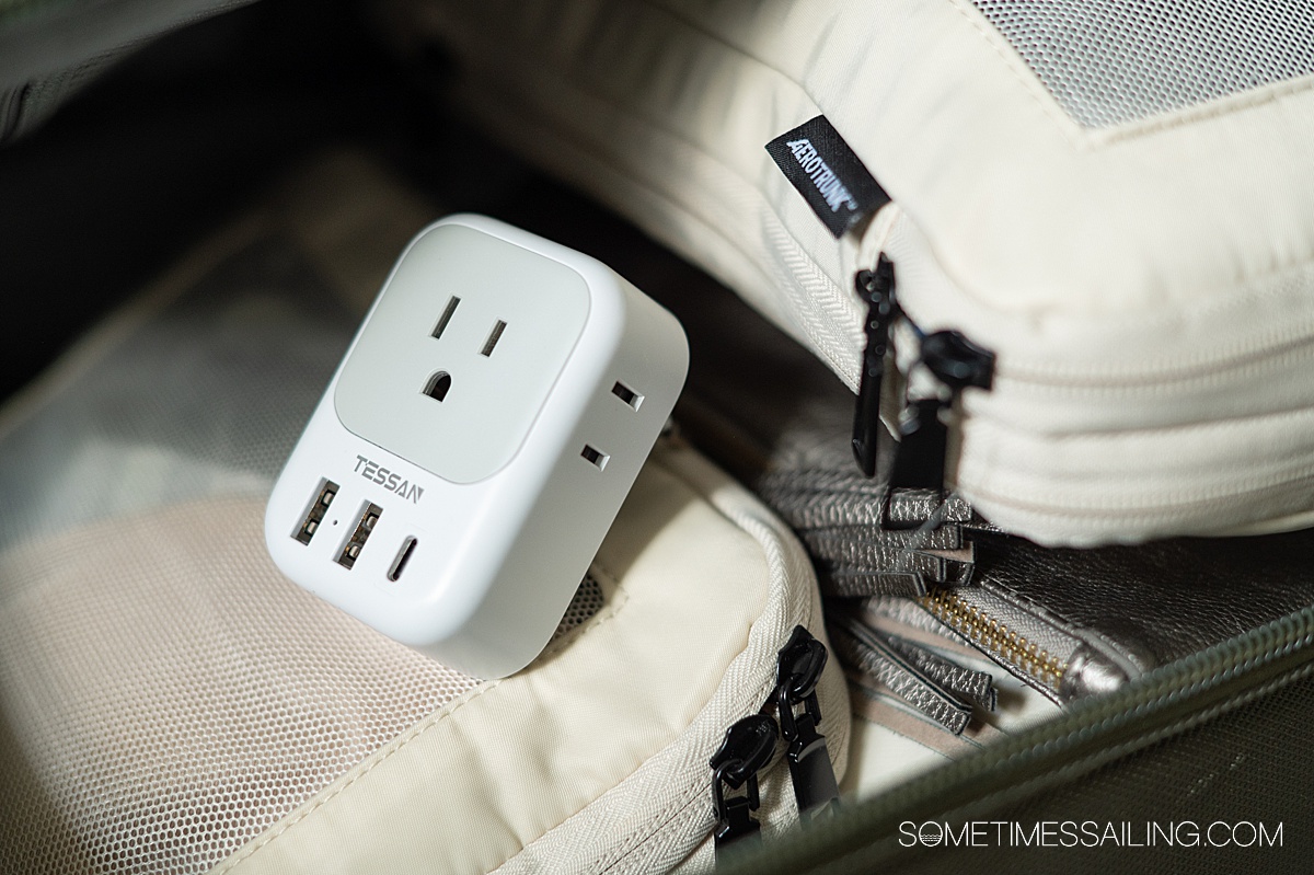 Close up of a travel adapter in a suitcase.