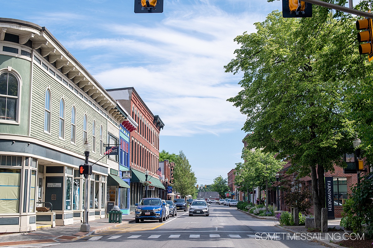 Main Street view of a small town in New England, on a summer day.