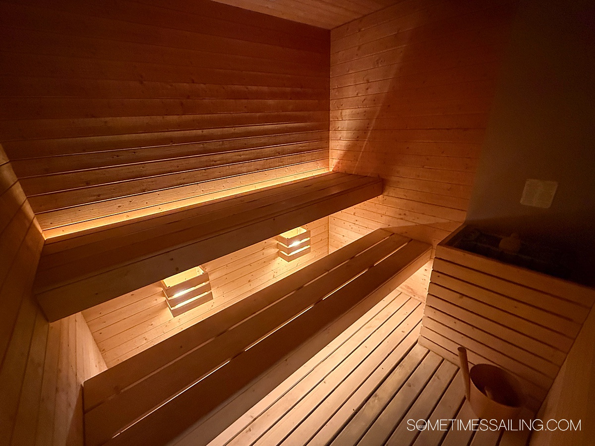 Wood illuminated interior of the sauna room.