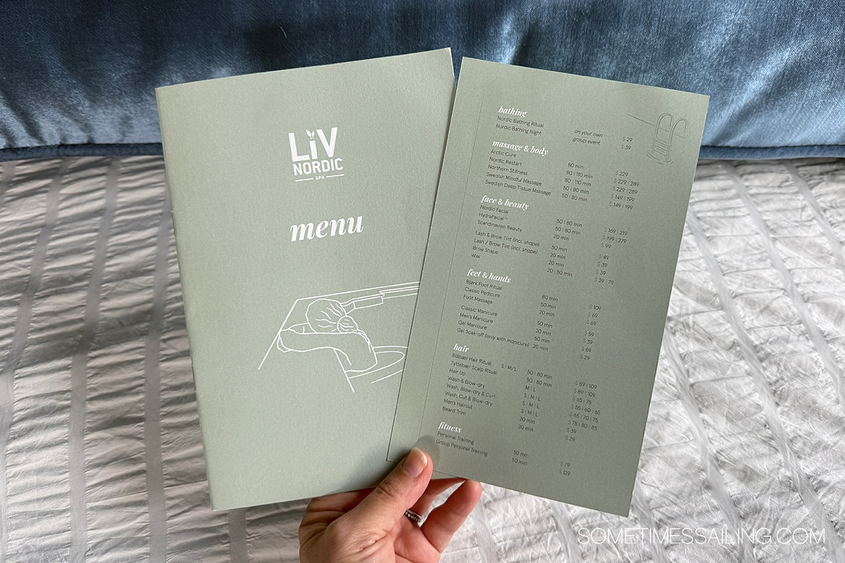 Hand holding two papers for the Viking LivNordic Spa.